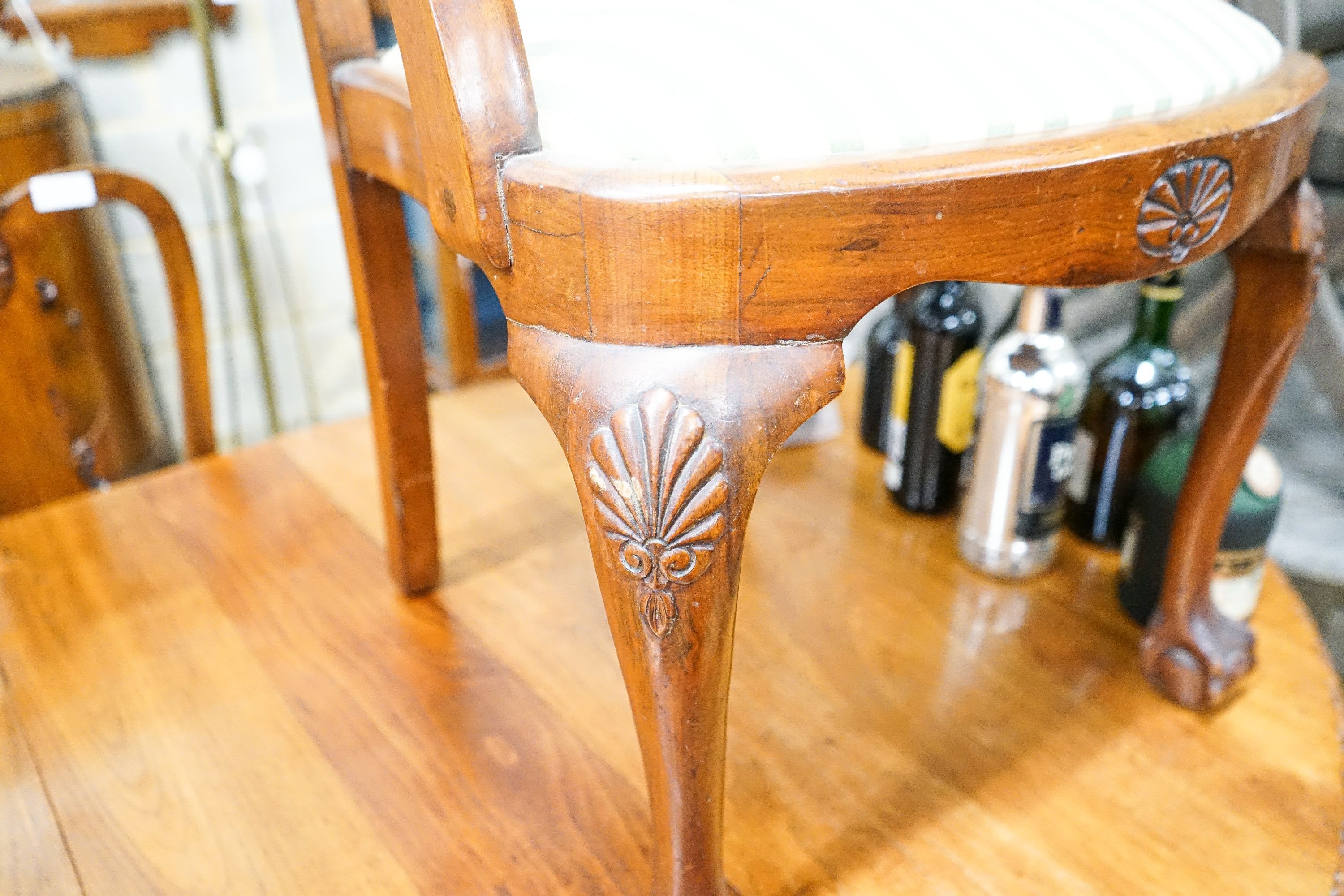 A Queen Anne style figured walnut dining suite comprising extending dining table, 200cm extended (one spare leaf), width 104cm, height 76cm, six chairs (two with arms) and a concave fronted sideboard